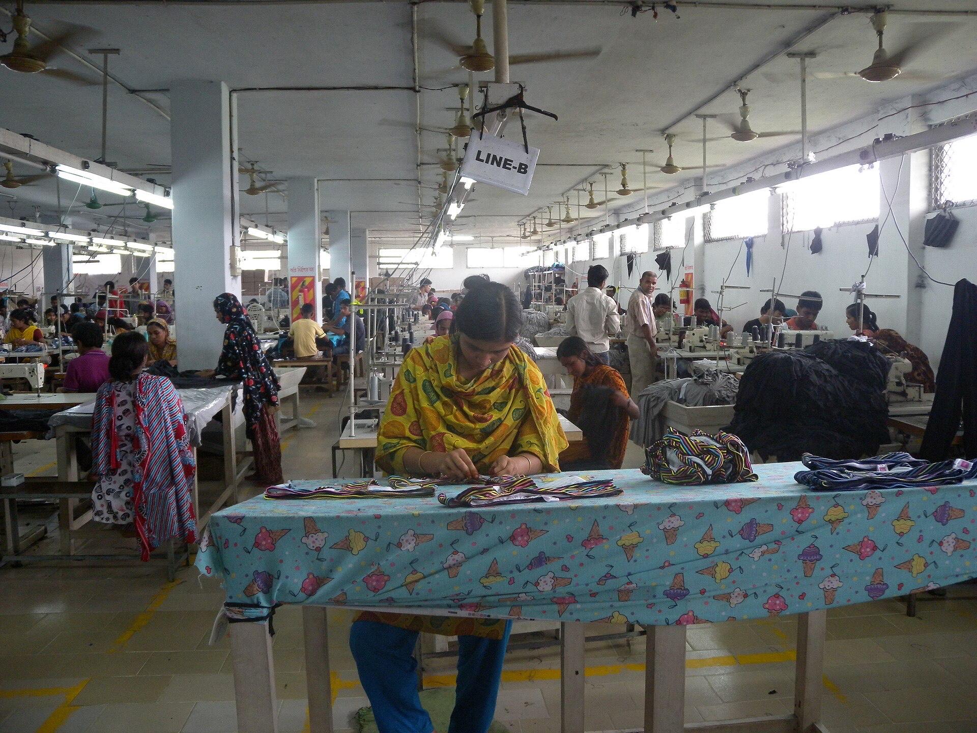 Garment workers at a production line in a Bangladesh clothing factory