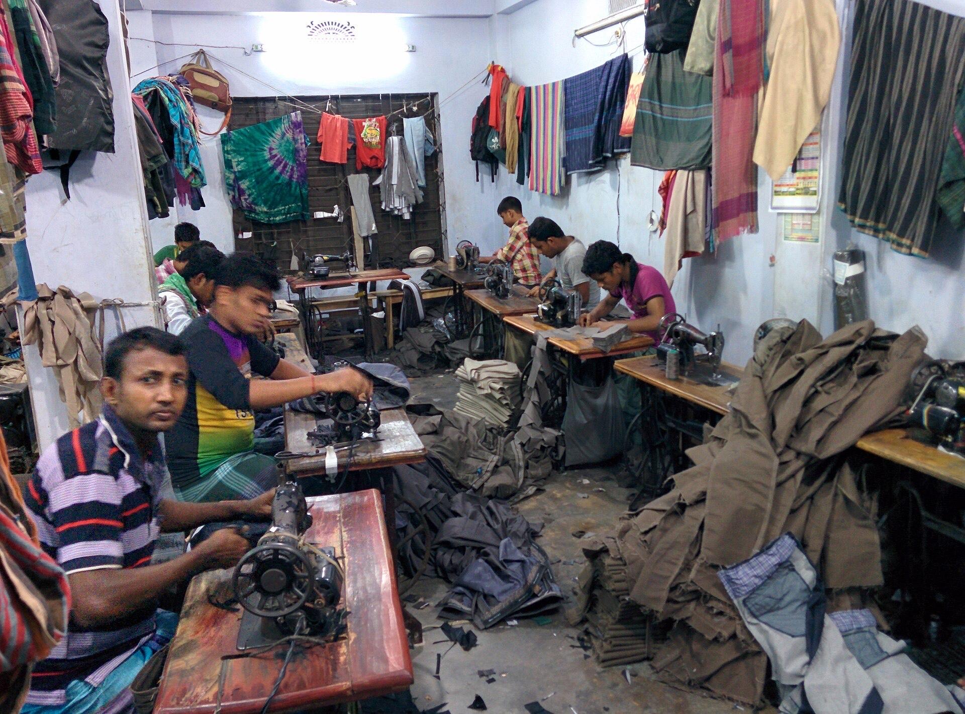 Rows of sewing stations inside a garment factory in Dhaka, Bangladesh